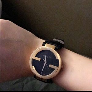 Unisex black and gold interlocking gucci watch